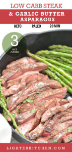 Steak and garlic asparagus cooked in a black cast iron pan.