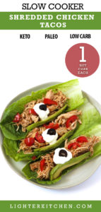Picture of shredded chicken tacos with tomatoes, avocados and sour cream.