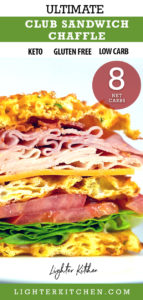 Picture of a Club Sandwich Chaffle on a white plate. Loaded with turkey, ham, cheese and bacon.