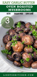 Oven Roasted Garlic Mushrooms in a white bowl topped with parsley.