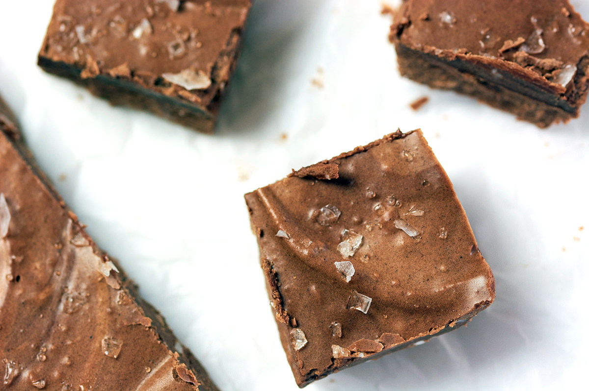 Close up of cut keto fudge with sea salt flakes on top.